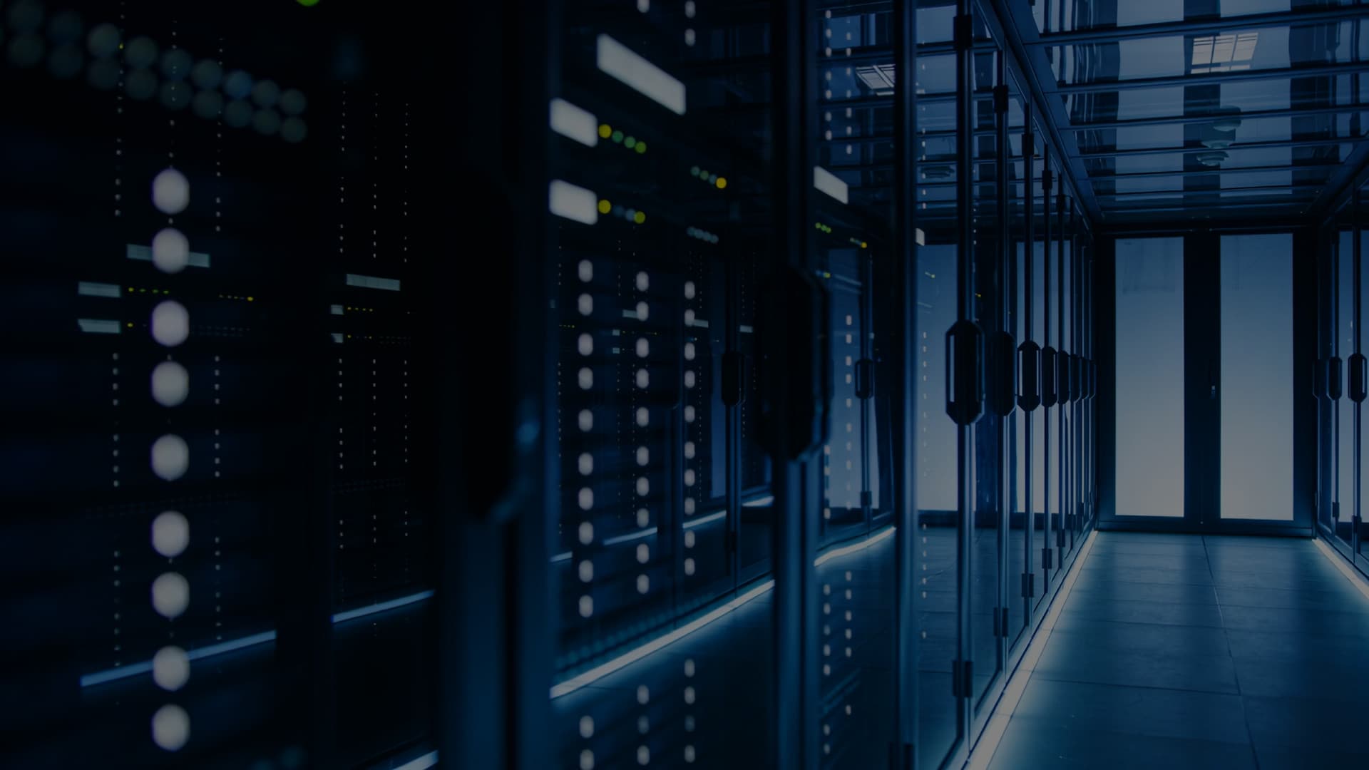 A row of illuminated server racks in a data centre aisle, and the TradingHost wordmark over it